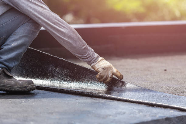 Professional Waterproofing technician working in Eland, WI